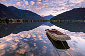 Boat moored in lake of Novate Mezzola at sunrise, Valchiavenna, Sondrio province, Valtellina, Lombardy, Italy