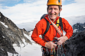 Mature man mountain climbing on Mount Stuart in North Cascade Mountains, Washington, USA