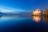 View of the Chillon castle on Lake Geneva at the blue hour. Veytaux, Montreux, Canton of Vaud, Switzerland.