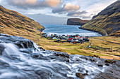 The cove of Tjornuvik and in background near the cliff the two sea stacks of Risin and Kellingin (Streymoy island, Faroe Islands, Denmark)