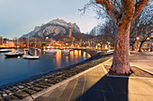 Lakefront of Lecco before dawn with San Martino mount in background, Lecco, Lecco province, Lombardy, italy