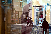 Reflection in a fashion shop in the pedestrian area in Porto, Portugal