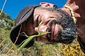 Hiker admires mantis (Mantis religiosa) in the Provence-Alpes-Côte d'Azur at Oppedette