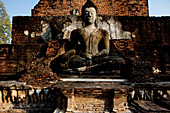 Sitting Buddha in the Historical Park of Sukhothai in the temple Wat Mahathat, ancient royal city, Sukhothai, Thailand