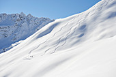 Skiers in deep snow, Austria, ski tours, freeride, South Tyrol, wintry mountains