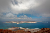 In the far north of Lanzarote is one of the popular viewpoint Mirador del Rio at 475 meters altitude on the cliffs of the Famara massif. Lanzarote, Canary Islands, Spain, Europe