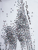 Aerial view large group of skiers on snowy slope, St. Moritz, Switzerland