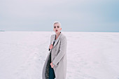 Portrait confident young woman in snowy landscape