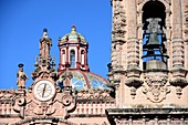 View of the tower with gocke, the clock and the colorful dome of the Igleisia de Santa Prisca in the colonial old town of Taxco, Mexico