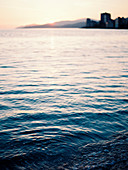 Tranquil scene with view of water in sea at sunset, Vancouver, British Columbia, Canada