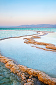 Salt deposits in the Dead Sea at sunset, Ein Bokek, Southern District, Israel