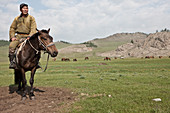Nomad man riding horse, Bunkhan Valley, Bulgam, Mongolia