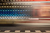 The subway platform of the station NÃ¡mÄ&gt; stÃ MÃru with light trace of the approaching train; Prague; Czechia