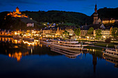 Town and Cochem Imperial Castle by river at sunset in Cochem, Germany
