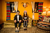 Man and woman in Dia de los Muertos makeup and costume, Day of the Dead celebration in the desert, California, United States of America, North America