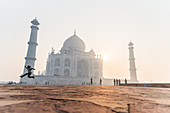 A man jumps as the sun rises behind the Taj Mahal, UNESCO World Heritage Site, Agra, Uttar Pradesh, India, Asia