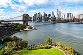 Brooklyn's Main Street Park, the East River, Brooklyn Bridge and Lower Manhattan, New York, United States of America, North America