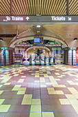 Turnstiles and signs in subway station, USA