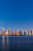 City skyline lit up at night, San Diego, California, United States