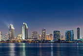 City skyline lit up at night, San Diego, California, United States