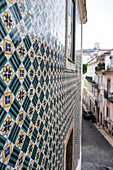 Patterned tiles on a house facade in Lisbon, Portugal