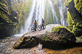Iceland, road trip, midsummer night, mountain bike, MTB, e-bike, cyclist, cave, waterfall