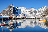 Ships in the port of Hamnoy with snowy mountains, Hamnoy, Lofoten, Nordland, Norway