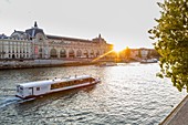 France, Paris, area listed as World Heritage by UNESCO, the Musée d'Orsay, a boat on the Seine