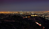 Los Angeles skyline at night with Griffith Observatory, USA