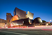 Walt Disney Concert Hall in Los Angeles at dusk with car lights