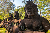 Statues at the entrance to Angkor Thom, Cambodia