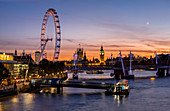 Millenium Wheel (London Eye) with Big Ben on the skyline beyond at sunset, London, England, United Kingdom, Europe