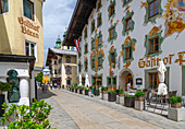 View of colourful architecture on Speckbackerstrassa in St. Johann in Tirol, Austrian Tyrol, Austria, Europe