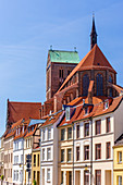 St. Nikolai gothic church, viewed  from the east end of MÃ¼hlengrube street, roofs of houses by the MÃ¼hlengrube, Wismar stadt, Mecklenburgâ€“Vorpommern, Germany.