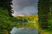 Karersee, natural monument under the rose garden, in the South Tyrolean Dolomites, UNESCO World Natural Heritage, in Eggental, Italy