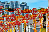 Colorful New Year decoration and a skyscraper in Chinatown, Singapore