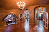 Living room with fireplace in the Casa Battlo by Gaudi, Barcelona