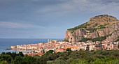 City of Cefalu with Rocca di Cefalù in the afternoon sun, Sicily Italy