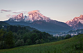 Snowy peaks of the Watzmann in Berchtesgaden with clouds at sunrise, Bavaria