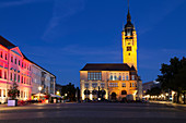 The illuminated city hall (Rathaus), with its Gothic-style clock tower, at night, in Dessau, Saxony-Anhalt, Germany, Europe