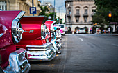 Colourful old American taxi cars parked in Havana at dusk, UNESCO World Heritage Site, La Habana, Cuba, West Indies, Caribbean, Central America