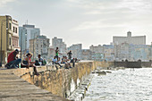 Fishing along the Malecon in late afternoon, Havana, Cuba, West Indies, Caribbean, Central America