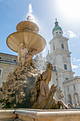 View of Baroque Fountain and Salzburg Cathedral in Residenzplatz, Salzburg, Austria, Europe