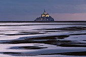 France, Manche, Mont Saint Michel listed as World Heritage by UNESCO, Mont Saint Michel from the littoral at sunset during the high tide of the century