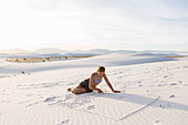 13 year old girl drawing in the sand, White Sands Nat'l Monument, NM