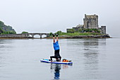 Stand up paddle boarding at Loch Duich, Eilean Donan Castle, Dornie, Highlands