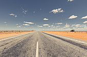 Off-road vehicle on a deserted road in the outback in Western Australia, Australia, Oceania;