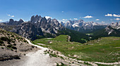 Hiking trail around the Three Peaks by day and blue sky in summer, South Tyrol