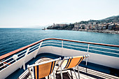 Deck chairs on the deck of the ferry off Bastia, Corsica, France.
