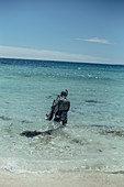 Divers on the beach in southwestern Australia, Oceania
